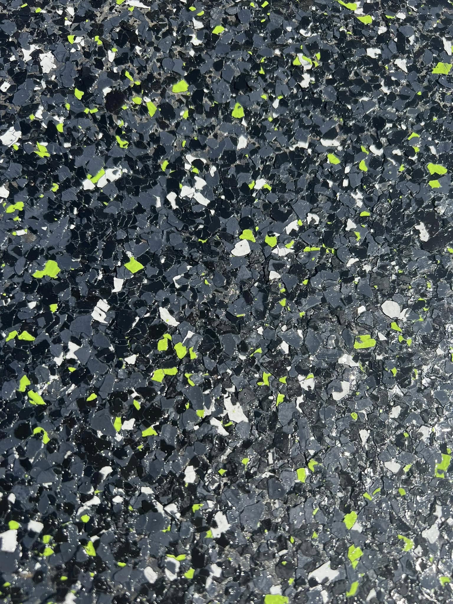 Custom flake mix close-up — black, white and primal green